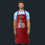 Game On Football Player Red Apron<br><div class="desc">Football game day apron features a football player on a red background and the words "Are You Ready, " Football Game Day, " and your family name at the top. You can change the black colour to your team colour with our edit tools. MATCHING items in our collection.</div>