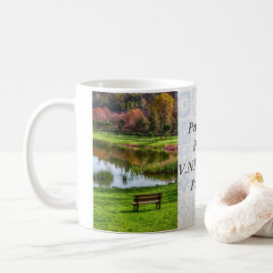 Garden bench overlooking lake/pond coffee mug