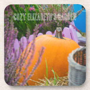 Garden still life with an orange pumpkin coaster