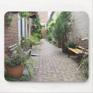 garden walkway cobblestone walkway benches plants mouse pad