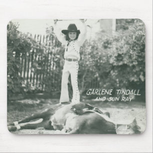 Garlene Tindall standing on a trick horse. Mouse Pad