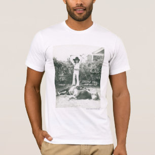 Garlene Tindall standing on a trick horse. T-Shirt
