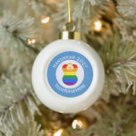Gay Price Blonde Angel Hanukkah Flag Personalised  Ceramic Ball Christmas Ornament<br><div class="desc">Blonde haired angel wears the Gay Pride Rainbow Flag to celebrate Hanukkah on this item for holiday decor. The blonde Gay Pride Hanukkah Angel is inside the white, squiggly squares circle. The circle is surrounded by a background of blue squiggly squares. Personalise with a name and customise with the year....</div>
