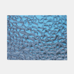 Gentle raindrops on blue glass doormat