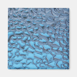 Gentle raindrops on blue glass magnet