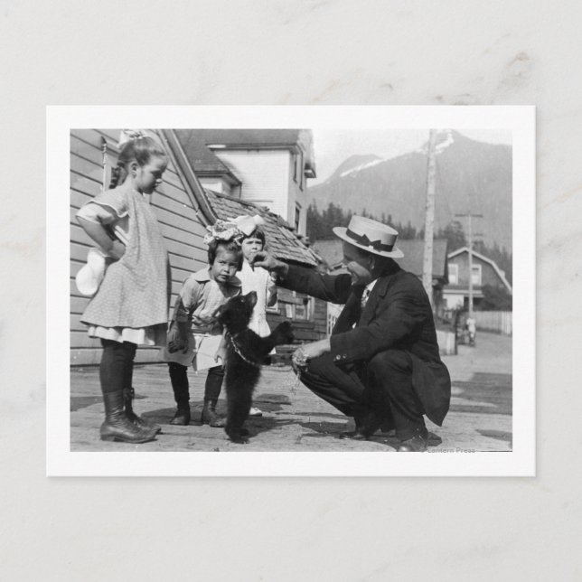 Gentleman and Kids Playing with Bear Cub On Leas Postcard (Front)