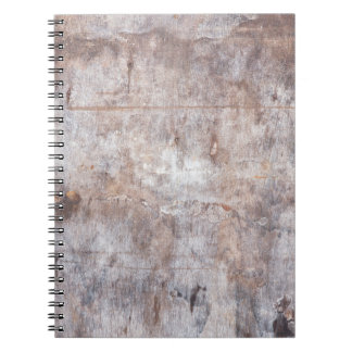 Genuine vintage washouts on the wooden surfaceaged notebook
