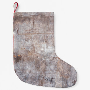 Genuine vintage washouts on the wooden surfaceaged small christmas stocking