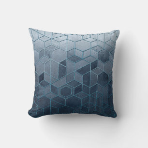 Geometric abstraction of hexagons on a blue relief cushion