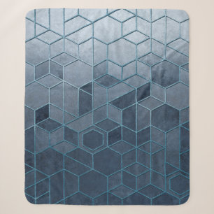 Geometric abstraction of hexagons on a blue relief sherpa blanket