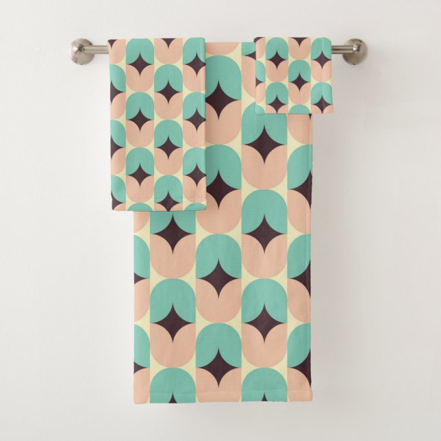 Geometric pattern of teal, beige, and black shapes bath towel set (Insitu)