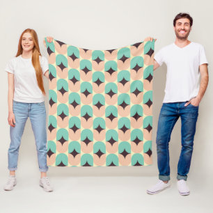 Geometric pattern of teal, beige, and black shapes fleece blanket