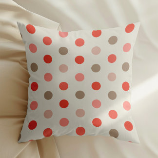 Geometric polka dot pattern in red and pink tones cushion