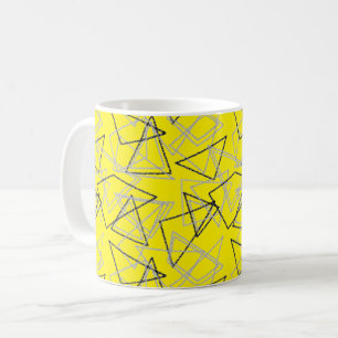 Geometric shapes in chalk on yellow coffee mug