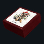 German Shepherd Puppy Christmas Holly Gift Box<br><div class="desc">The image on the lid of this cute Holiday gift box is of an adorable German Shepherd puppy wearing a red and white Santa Claus hat. Behind him is a sprig of holly and red berries. Tiny gold confetti on a white background gives a bit of glitter to the background....</div>