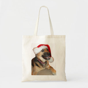 German Shepherd wearing a Santa Claus Hat Tote Bag