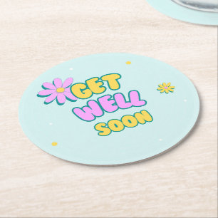 Get well soon bold text with flowers on blue round paper coaster