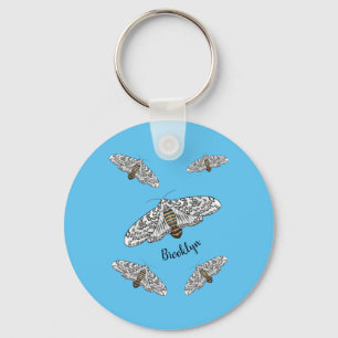 Giant leopard moth cartoon illustration key ring