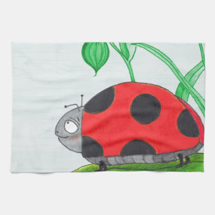 Giant red ladybug on a leaf tea towel