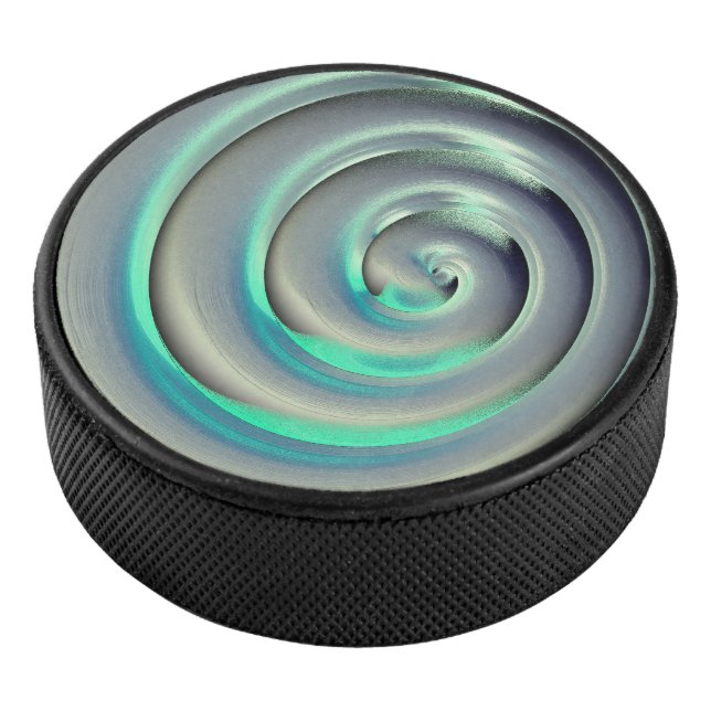 Giant silver and aquamarine spiral over black hockey puck (3/4)