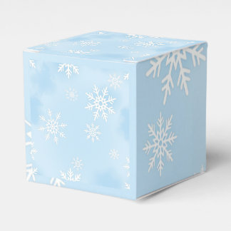 Gift Box with White Snowflakes on Blue Background 