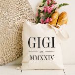 Gigi Roman Numeral Year Established Tote Bag<br><div class="desc">A modern minimalist tote bag to celebrate a chic grandma,  this clean minimal tote features "Gigi" or your choice of grandma nickname in black serif lettering. Customise with the year she became a grandmother beneath in elegant roman numerals for a chic touch.</div>