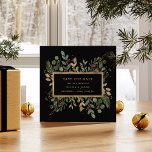 Gilded Greenery on Black | Christmas Holiday Photo Save The Date<br><div class="desc">This stunning Christmas wedding save the date features holiday greenery and leaves with faux gold leaves and red holly berries,  and a centre gold frame on a modern black background. Your personal photo goes on the back,  surrounded by another gold geometric frame with winter greenery.</div>