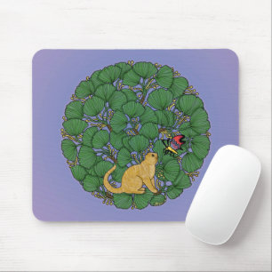 Ginger cat looks at a butterfly mouse pad