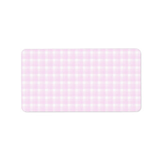 Gingham check pattern. Pale pink and white. Label