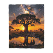Giraffe dinking water in African Cosmic Sunset Fle