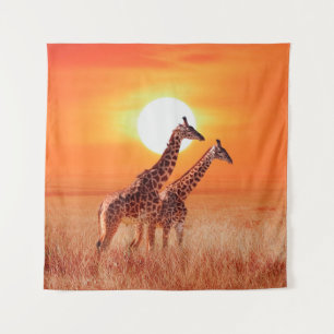 Giraffe in the African savanna against the backdro Tapestry