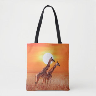 Giraffe in the African savanna against the backdro Tote Bag