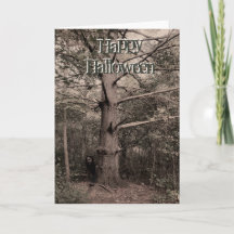 Girl behind tree halloween card