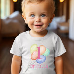 Girl First Birthday Balloons and Name Baby T-Shirt<br><div class="desc">Celebrate your daughter's first birthday with this sweet first birthday shirt that features her name and birthday age over watercolor pastel balloons. MATCHING items in our collection.</div>