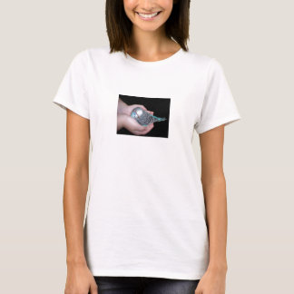 Girl holding baby budgie baby doll shirt