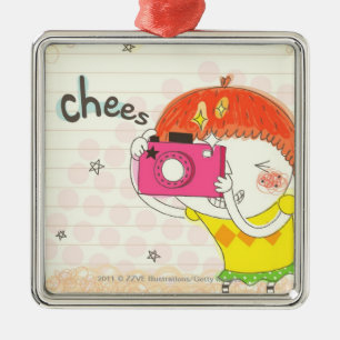 Girl holding camera, clicking metal ornament