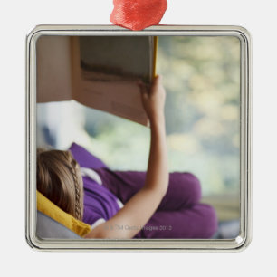 Girl laying down reading book metal tree decoration