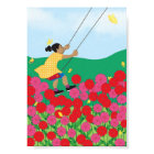 Girl on a swing with flowers