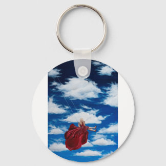 Girl on swing in clouds key ring