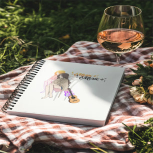 Girl Sitting with getar& Music Notes–Aesthe Notebook