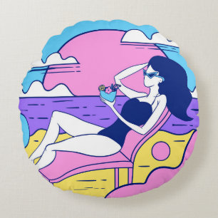 girl sunbathes on the beach with a cocktail in han round cushion