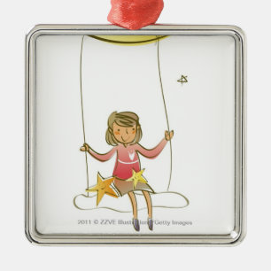 Girl swinging on a rope hanging from crescent moon metal tree decoration