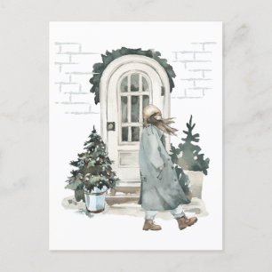 Girl walking in the street in the winter postcard
