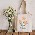 Girls Cute and Elegant Pink Flowers Tote Bag<br><div class="desc">This elegant and modern floral tote bag design features cute pink flowers,  and has space for you to add a girls name in a whimsical font. A perfect gift for flower loving adults or kids,  the perfect flower girl gift!</div>