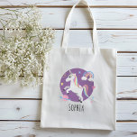 Girls Cute Purple Unicorn Rainbow & Name Kids Tote Bag<br><div class="desc">This cute and adorable unicorn themed kids tote bag features a unicorn cartoon,  planet,  stars,  a crown,  a rainbow and heart,  and can be personalised with your girls name. The perfect purple magical gift for your unicorn or princess loving child or toddler.</div>
