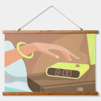 Girls hand pushing on alarm clock snooze button