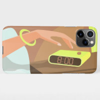 Girls hand pushing on alarm clock snooze button