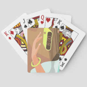 Girls hand pushing on alarm clock snooze button playing cards