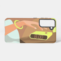 Girls hand pushing on alarm clock snooze button