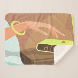 Girls hand pushing on alarm clock snooze button sherpa blanket